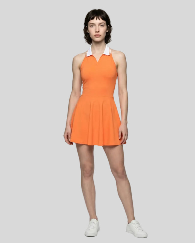 Model wearing orange Athlesi TrackLine Court Dress front view