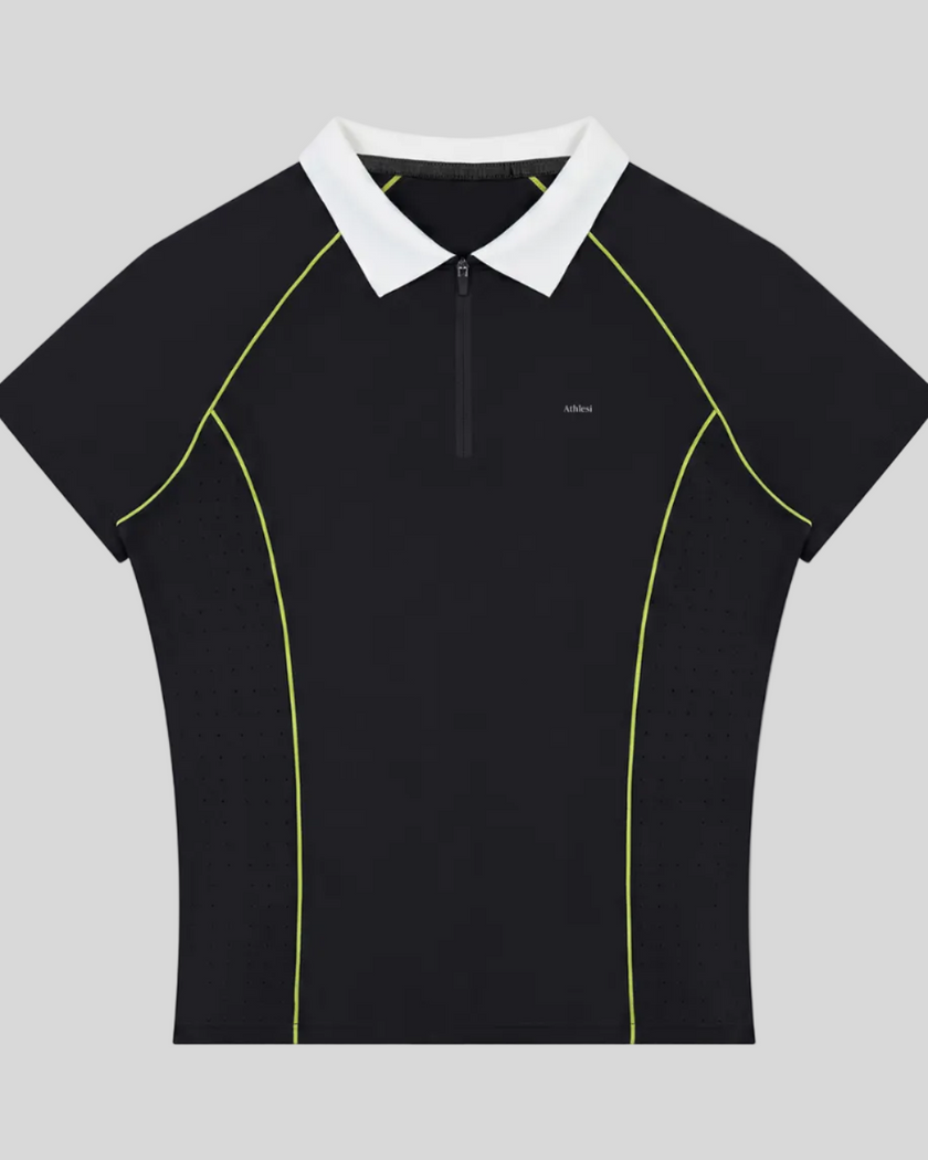 TrackLine Court Polo in Black featuring a quarter-zip collar, slim fit silhouette, and contrast piping details.