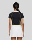 Back view of a female model wearing the TrackLine Court Polo in Black