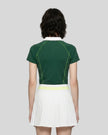 Back view of a female model wearing the TrackLine Court Polo in Blackish Green