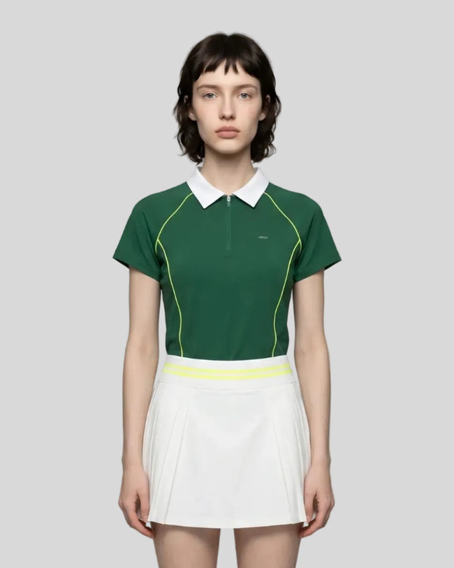 Female model wearing the TrackLine Court Polo in Blackish Green viewed from the front