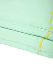 Hem and contrast piping detail of the TrackLine Court Polo in Mint Green.