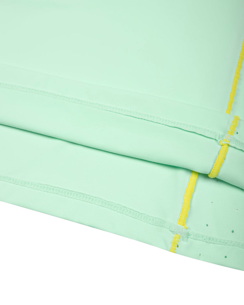 Hem and contrast piping detail of the TrackLine Court Polo in Mint Green.