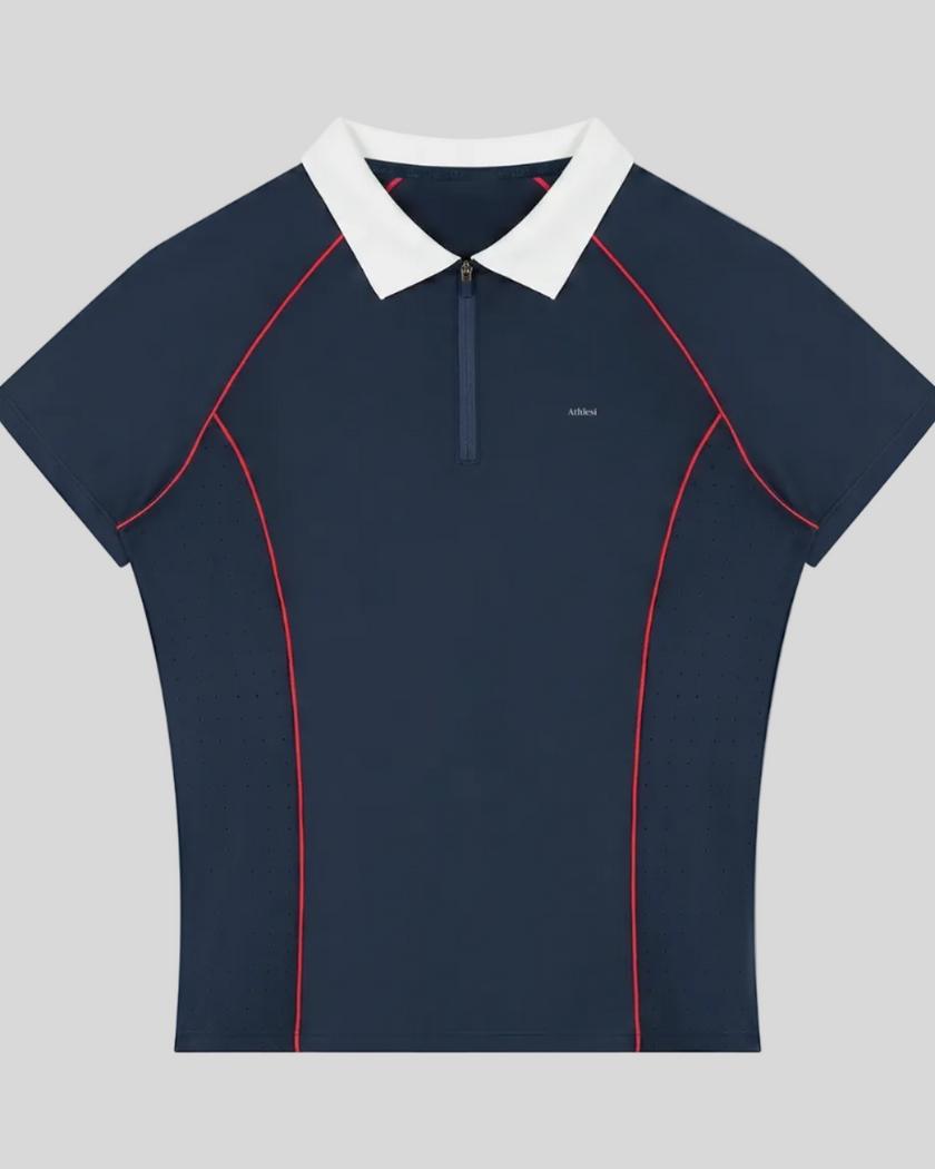 TrackLine Court Polo in Navy Blue featuring a quarter-zip collar, slim fit silhouette, and contrast piping details.