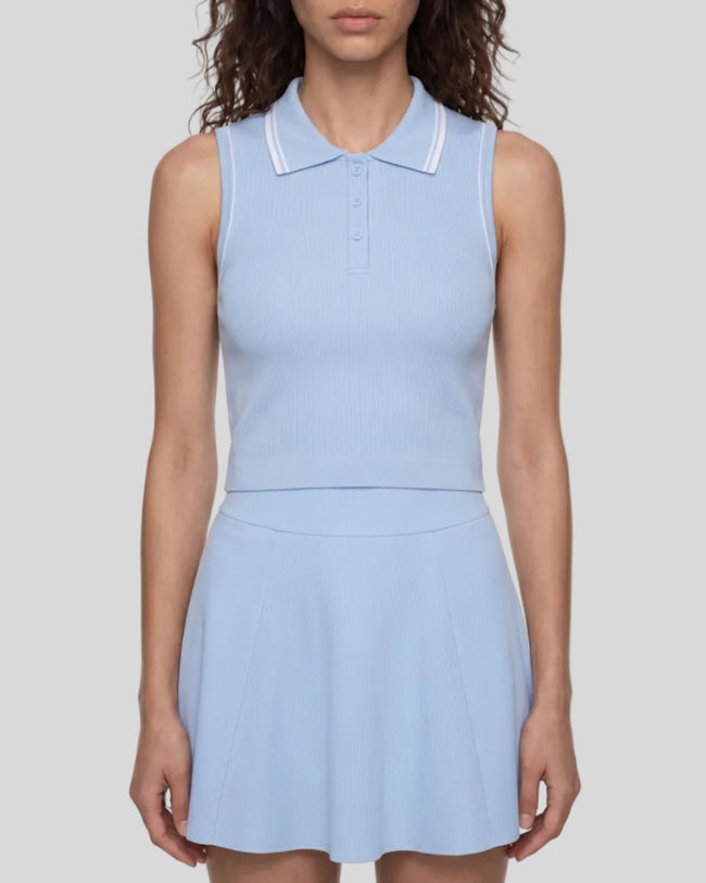 Model wearing the TrackLine Court Polo Tank Top in Blue with White viewed mid body from the front