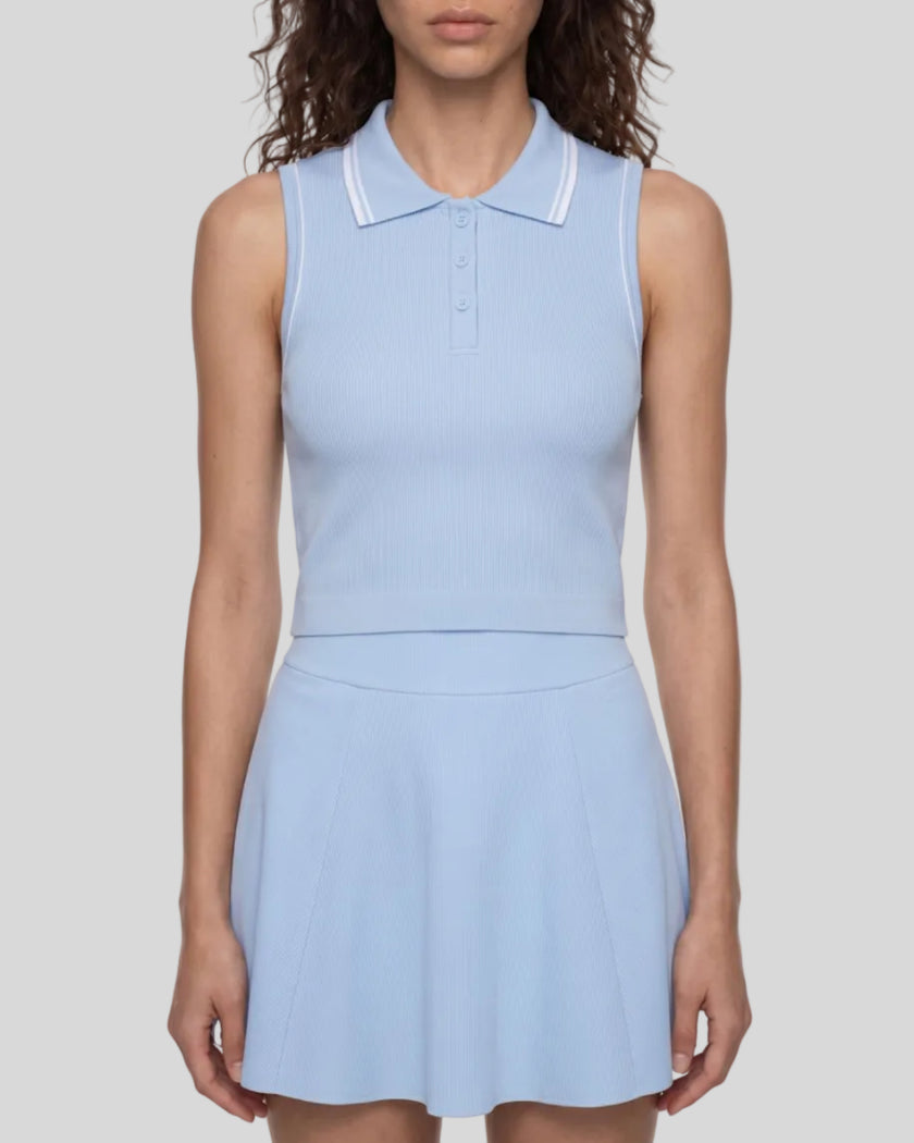 Model wearing the TrackLine Court Polo Tank Top in Blue with White viewed mid body from the front