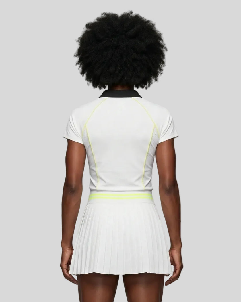 Back view of a female model wearing the TrackLine Court Polo in White