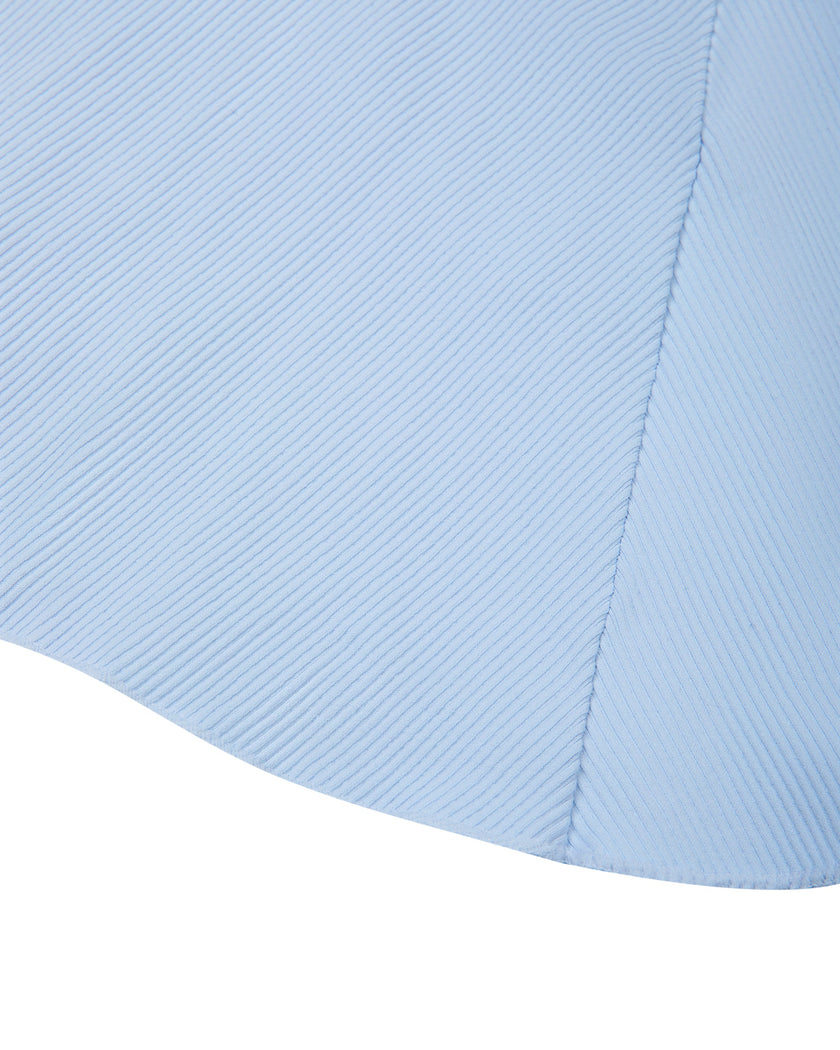 Close-up of the hem and flowing silhouette of the TrackLine Court Skirt in Blue.