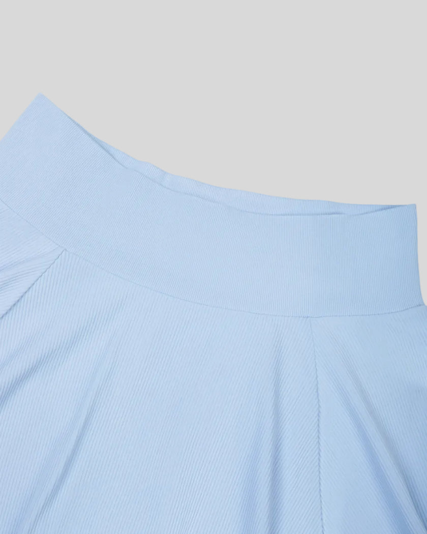 Close-up of the high-rise waistband on the TrackLine Court Skirt in Blue.
