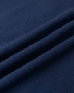 Closeup of the cotton blend fabric texture on the Athlesi TrackLine Cropped Hoodie in blue