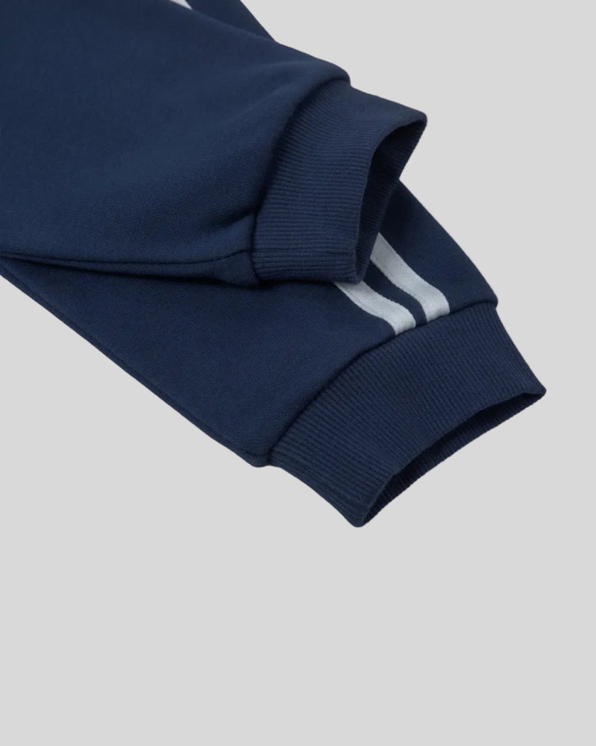 Closeup of the sleeve cuff and stripe detail on the Athlesi TrackLine Cropped Hoodie in blue