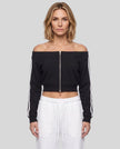 Upper body front view of woman wearing TrackLine Edge Jacket zipped closed in Black