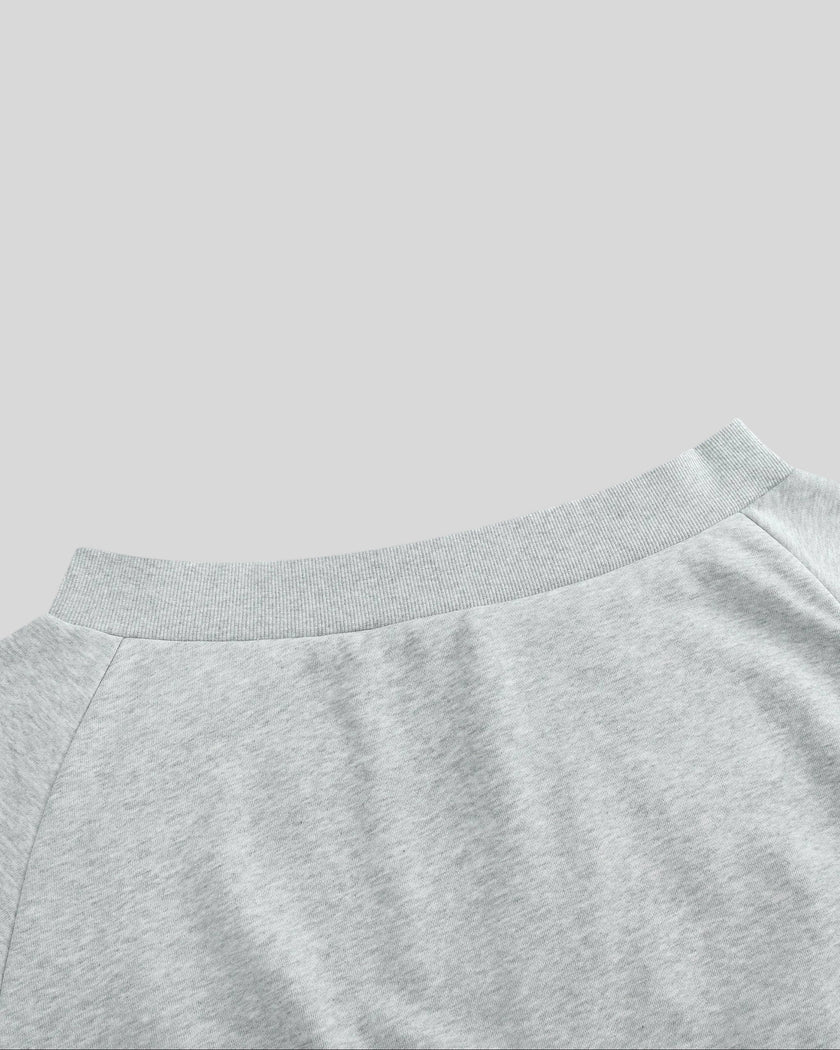 Closeup of wide ribbed off-shoulder neckline from the back on TrackLine Edge Jacket