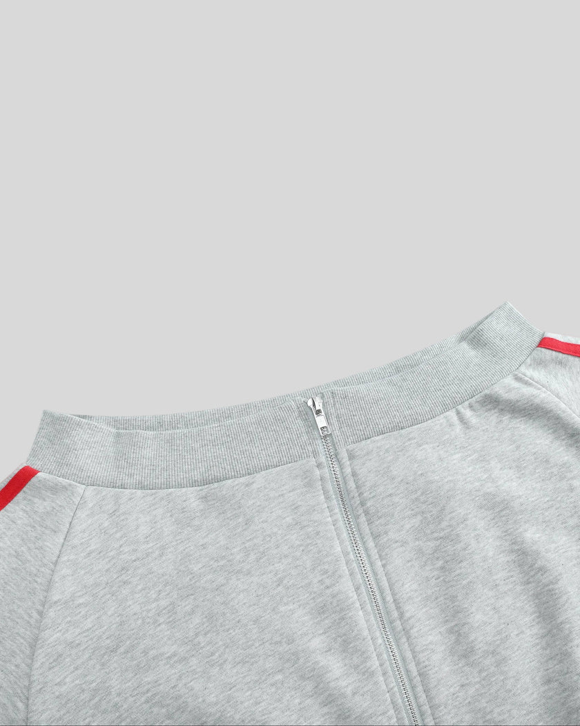 Closeup of ribbed off-shoulder neckline and full zipper on TrackLine Edge Jacket in Flower Gray