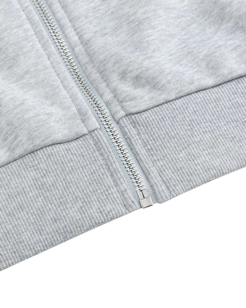 Closeup of full zipper and ribbed cropped hem on TrackLine Edge Jacket in Flower Gray