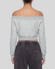 Upper body back view of woman wearing TrackLine Edge Jacket with off-shoulder neckline in Flower Gray