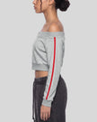 Upper body side view of woman wearing cropped TrackLine Edge Jacket in Flower Gray