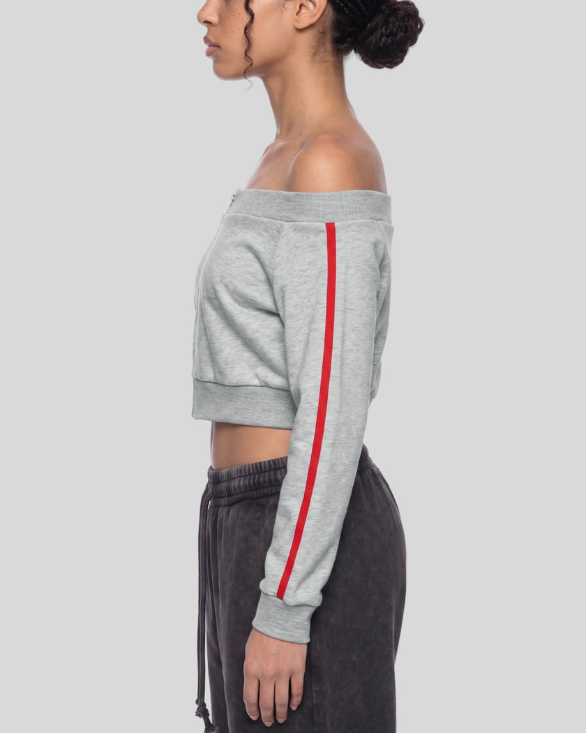 Upper body side view of woman wearing cropped TrackLine Edge Jacket in Flower Gray