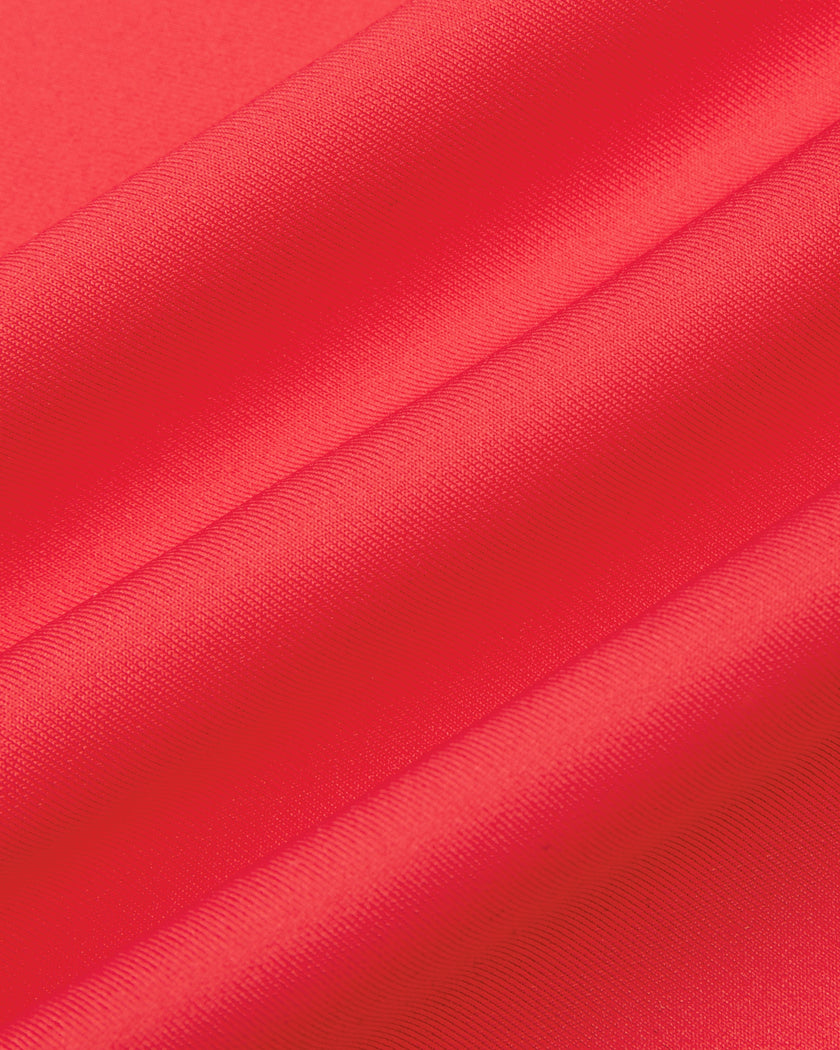 Close-up of the smooth stretch fabric on the Athlesi TrackLine Edge Leggings in red
