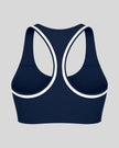 Athlesi TrackLine Edge Sports Bra in navy blue with white contrast trim and racerback design, back view