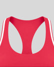 Close-up of the neckline and white contrast trim on the Athlesi TrackLine Edge Sports Bra in red