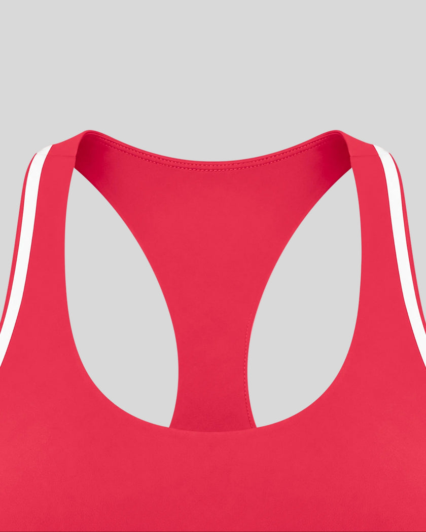 Close-up of the neckline and white contrast trim on the Athlesi TrackLine Edge Sports Bra in red