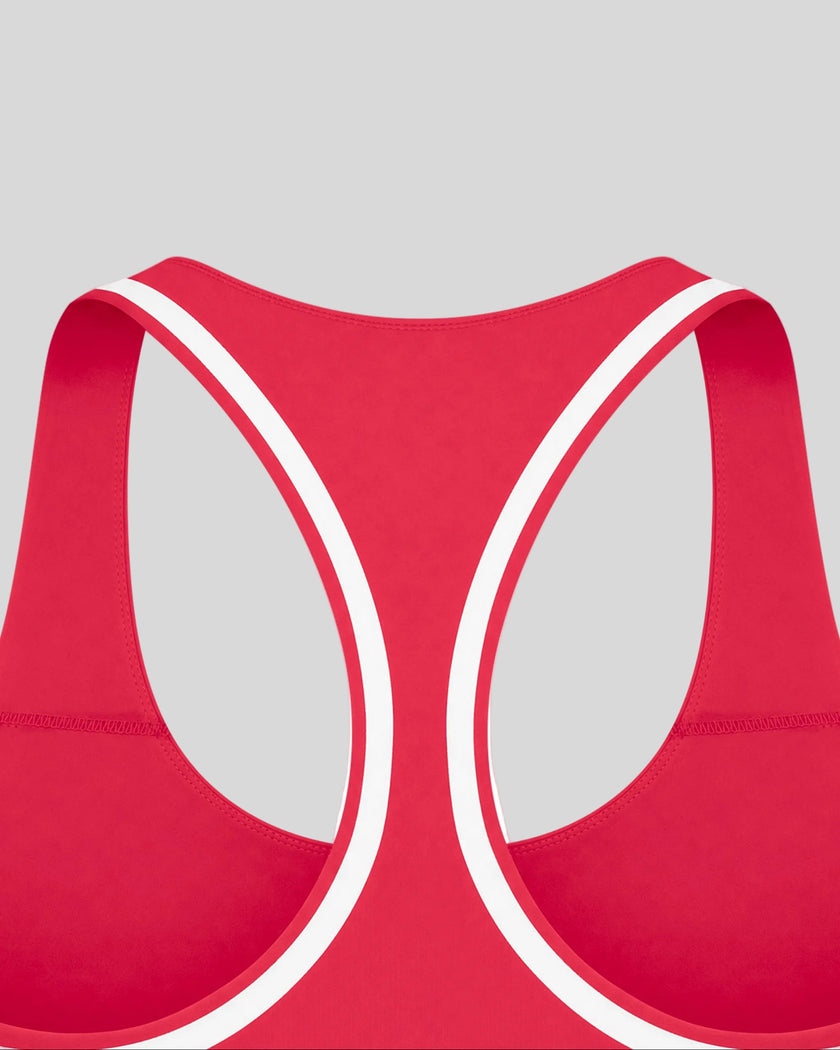 Close-up of the racerback and white contrast binding on the Athlesi TrackLine Edge Sports Bra in red