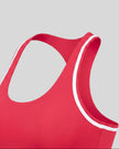Side angle close-up of the Athlesi TrackLine Edge Sports Bra in red with white contrast trim