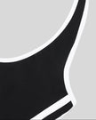 Armhole and side stripe detail closeup of the Athlesi TrackLine Halter Dress in black