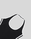 Front neckline closeup of the Athlesi TrackLine Halter Dress in black