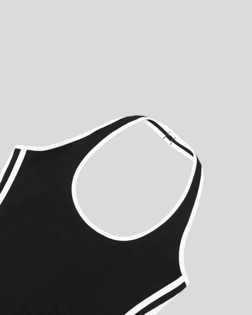 Front neckline closeup of the Athlesi TrackLine Halter Dress in black