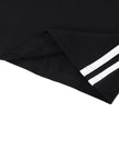 Hem detail closeup of the Athlesi TrackLine Halter Dress in black