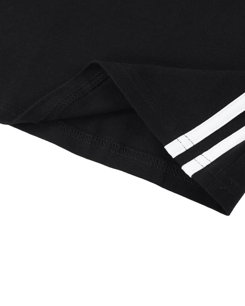 Hem detail closeup of the Athlesi TrackLine Halter Dress in black