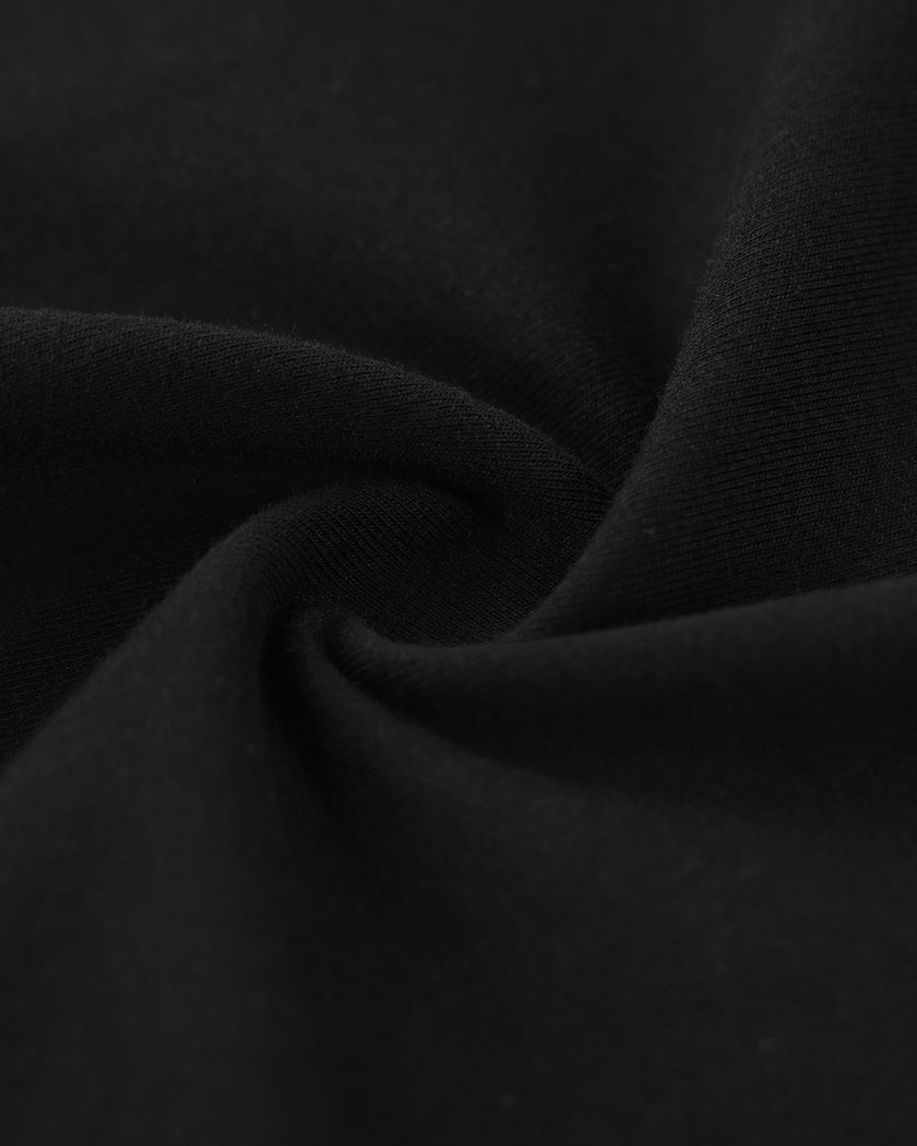 Closeup of the stretch cotton fabric on the Athlesi TrackLine Halter Dress in black