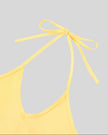 Front halter neckline detail closeup of the Athlesi TrackLine Halter Tank in yellow and white