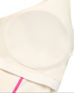Closeup of built-in chest padding on TrackLine Halter Yoga Top in apricot