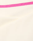 Closeup of smooth stretch fabric and contrast stitching on TrackLine Halter Yoga Top in apricot
