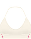 Closeup of adjustable halter strap and back neckline on TrackLine Halter Yoga Top in apricot