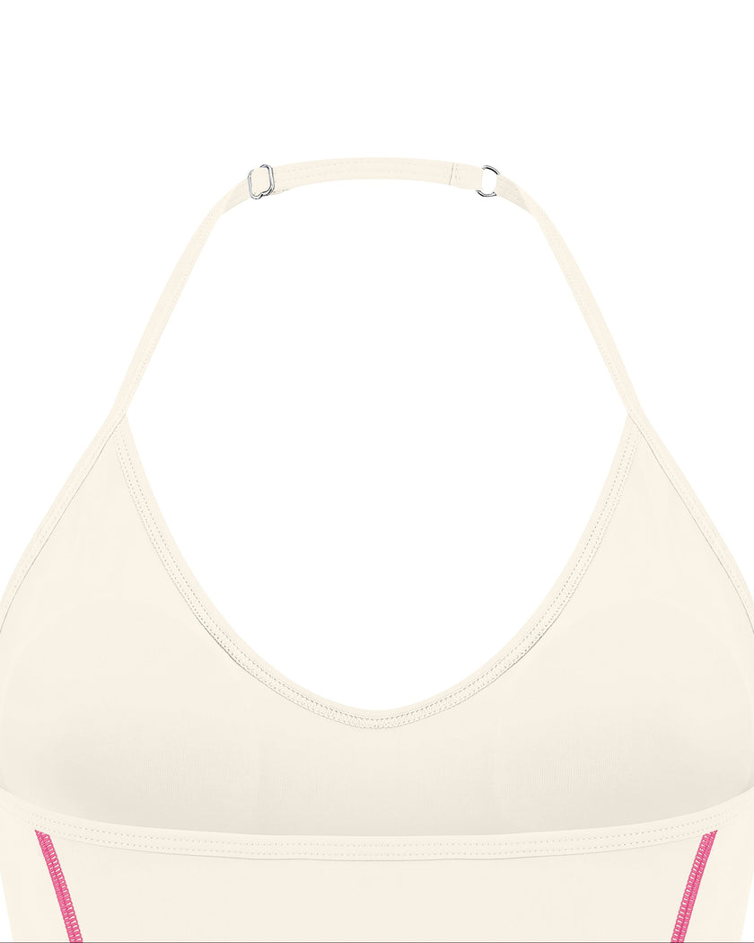 Closeup of adjustable halter strap and back neckline on TrackLine Halter Yoga Top in apricot