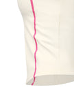 Closeup of cropped straight hem and contrast stitching on TrackLine Halter Yoga Top in apricot