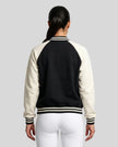 Model wearing TrackLine Heritage Jacket in Black with Apricot back view