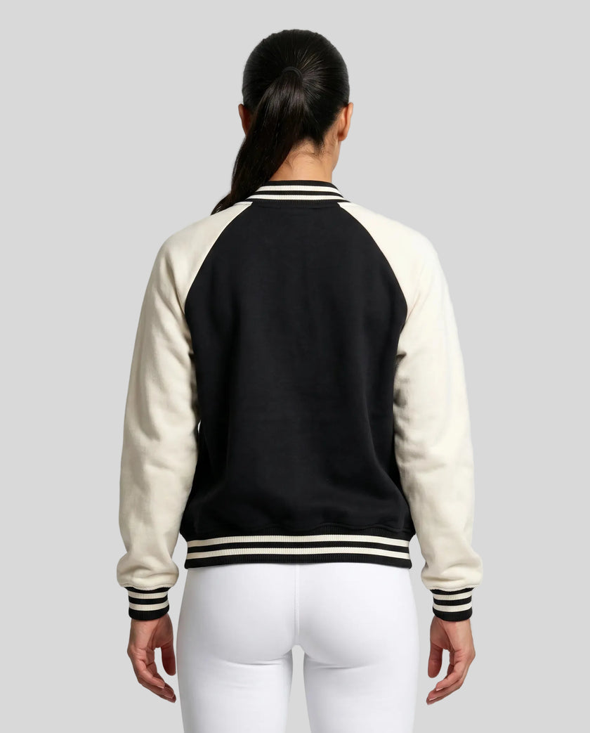 Model wearing TrackLine Heritage Jacket in Black with Apricot back view