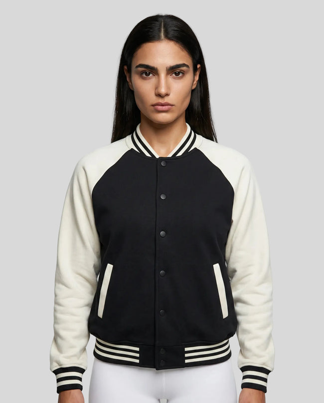 Model wearing TrackLine Heritage Jacket in Black with Apricot front view