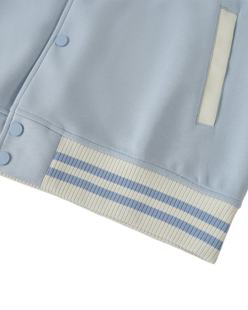 Striped waistband and snap button detail of TrackLine Heritage Jacket in Light Blue with Apricot
