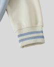 Contrast raglan sleeve detail of TrackLine Heritage Jacket in Light Blue with Apricot