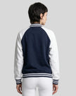 Model wearing TrackLine Heritage Jacket in Navy Blue with White back view