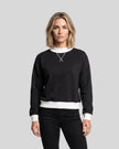 Model wearing the Athlesi TrackLine Heritage Sweatshirt in black with white contrast trim, front view