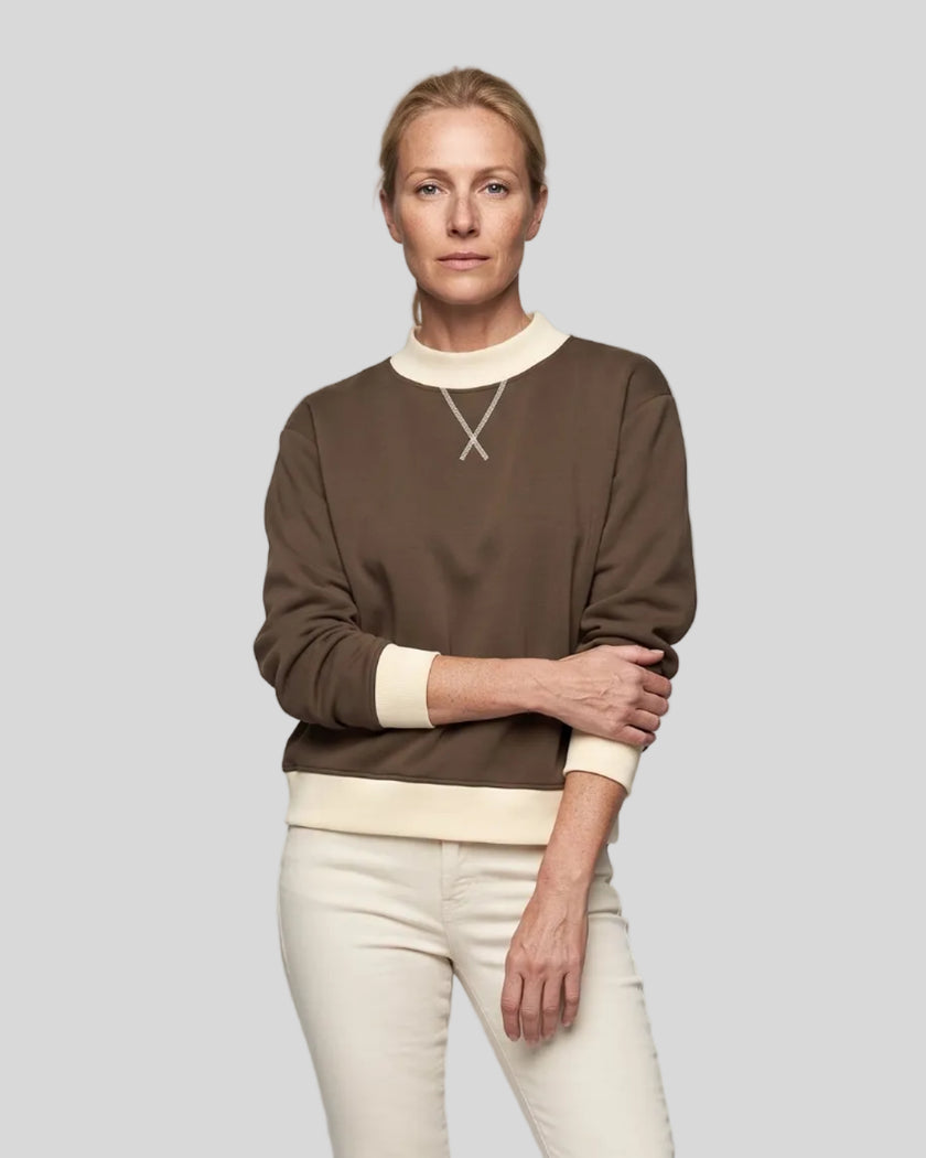 Model wearing the Athlesi TrackLine Heritage Sweatshirt in brown with apricot contrast trim, front view