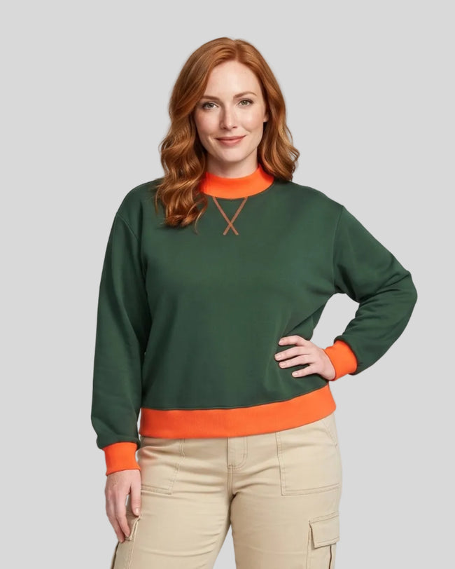 Model wearing the Athlesi TrackLine Heritage Sweatshirt in dark green with orange contrast trim, front view