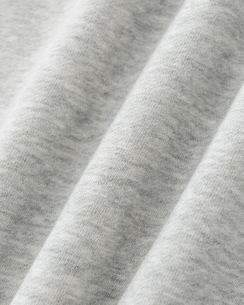 Close-up of the knit fabric texture on the red Athlesi TrackLine Heritage Sweatshirt